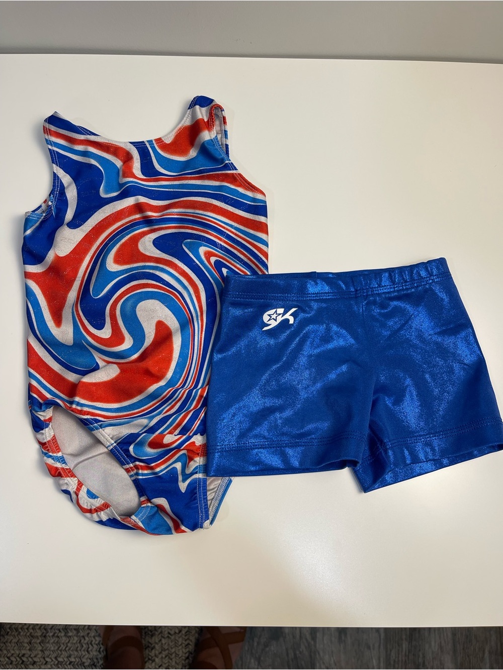 GK gymnastics shorts zoneRed, White & Blue Swirl leotard child med very good con